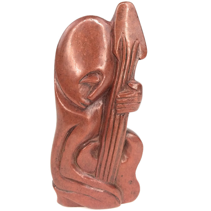 Red Stone Abstract Guitarist Hand Carved In Zimbabwe