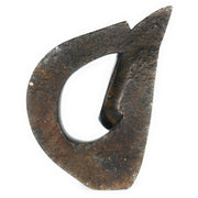 A brown, abstract-shaped stone sculpture of a face.