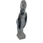 A black stone sculpture of a lady's figure, hand-carved in Zimbabwe.