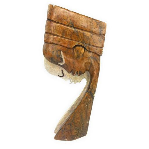 A handcrafted stone sculpture of a praying couple, with a muted color palette, representing the eternal love between a man and a woman, slightly imperfect on the side.