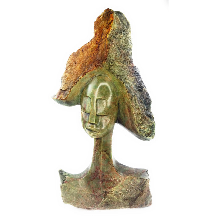 A hand-carved stone sculpture of a woman's head with a stylized hairdo, primarily in green and brown tones, with visible natural stone imperfections.