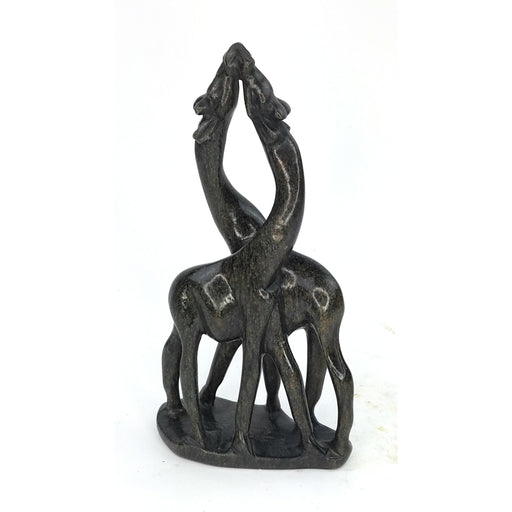 A serpentine stone sculpture of two giraffes in an embrace, hand-carved by Shona artisans in Zimbabwe.