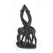 A serpentine stone sculpture of two giraffes in an embrace, hand-carved by Shona artisans in Zimbabwe.