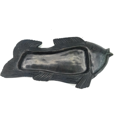 A black serpentine stone fish-shaped soap dish/ashtray handmade in Zimbabwe.