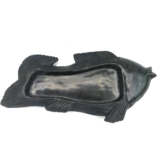 A black serpentine stone fish-shaped soap dish/ashtray handmade in Zimbabwe.