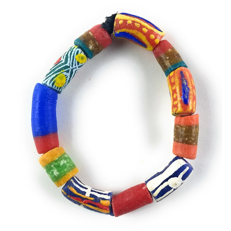 A multicolored beaded bracelet with a variety of geometric patterns and figures.