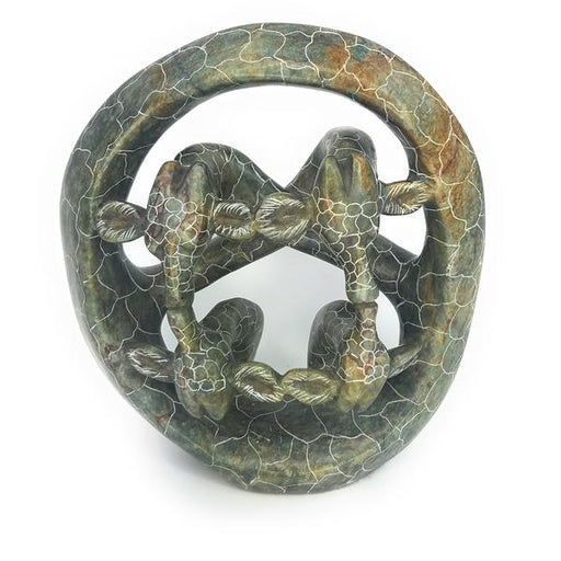 A hand-carved serpentine stone sculpture of a giraffe family, with intricate patterns and a mottled green finish.