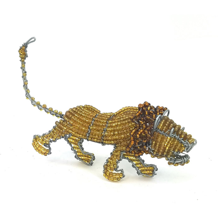 A three-dimensional beaded sculpture of a lion, handcrafted from steel wire with a skin of beads, against a white background.