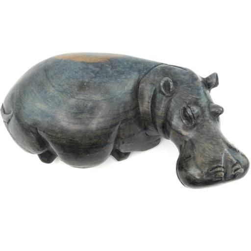 A hand-carved serpentine stone sculpture of a hippo, with a dark, textured finish.