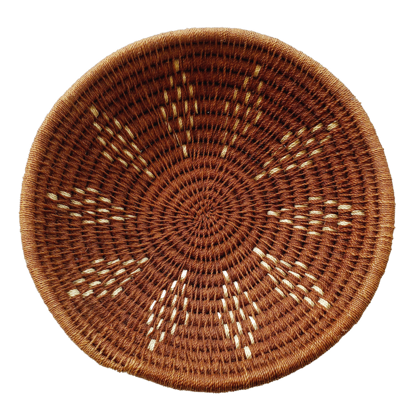 A handwoven Lutsindzi grass basket from Swaziland, with a natural brown color and geometric pattern design.