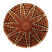 A hand-woven Lutsindzi grass basket from Swaziland, with a geometric pattern in brown and beige tones.