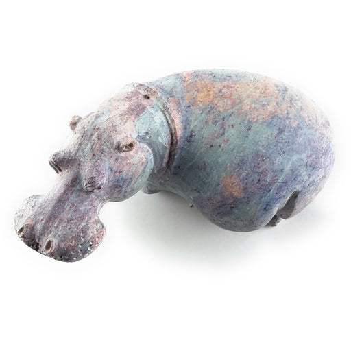 A hand-carved stone sculpture of a hippo, with a serrated edge indicating the sculpture was created from a single piece of stone.