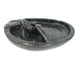 A serpentine stone soap dish with a floating pelican bird design, handcrafted in Zimbabwe.