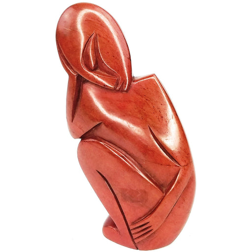 A red jasper stone sculpture of an abstract person with a tapered and curved form, handcrafted in Zimbabwe.