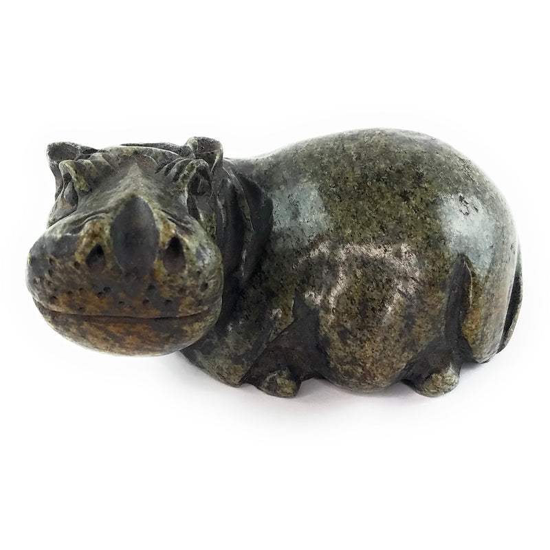 A hand-carved serpentine stone sculpture of a hippo, with a naturalistic and rustic finish.