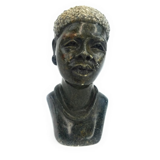 A black Shona stone male bust, handcrafted in Zimbabwe, showing realistic facial features.