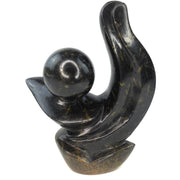 A hand-carved stone sculpture of an abstract plant, predominantly black in color, with a smooth and polished finish.