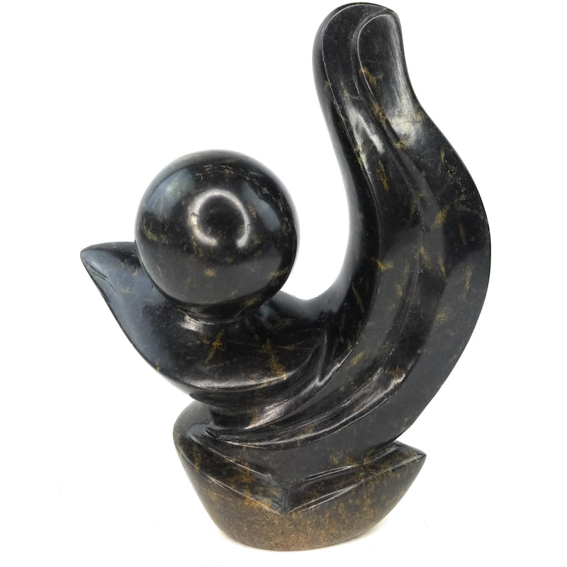 A hand-carved stone sculpture of an abstract plant, predominantly black in color, with a smooth and polished finish.