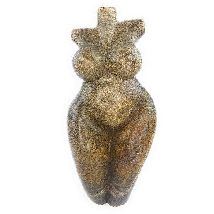 A handcrafted stone sculpture of a female torso, with exaggerated hips and breasts, representing the fertility of Mother Earth.