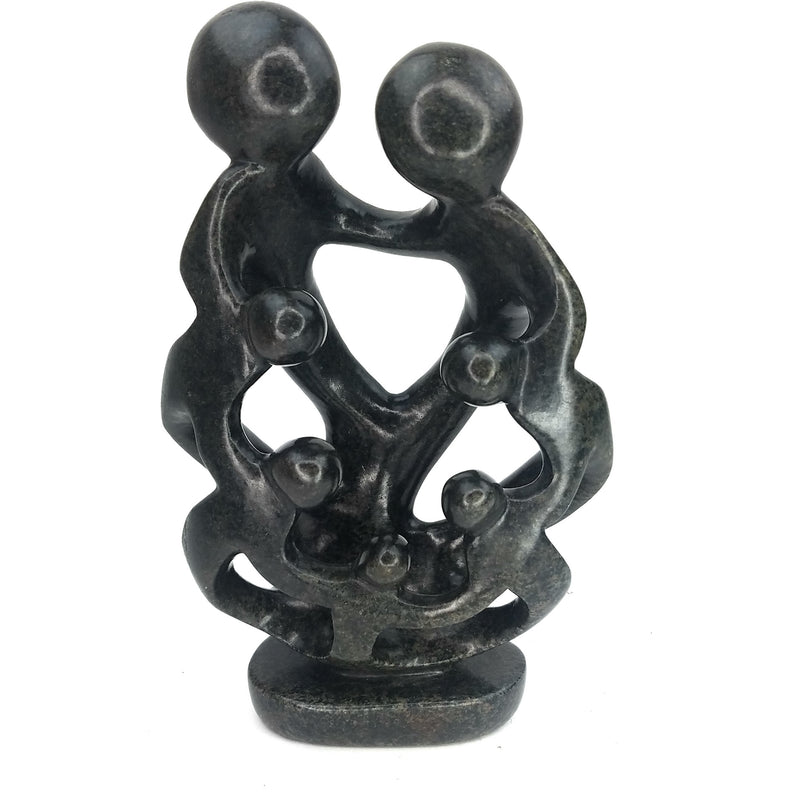 A hand-carved sculpture depicting a family of seven with interlinked arms, made from the dark serpentine stone.