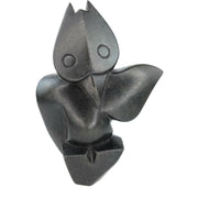 A black, hand-carved serpentine owl sculpture, measuring approximately 11 inches in height, 2.5 inches in width, and 6 inches in length, with a wingspan of 2 inches.
